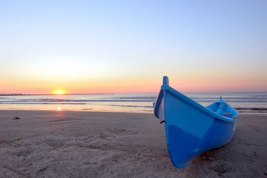 Fishing boat and sunrise at black sea