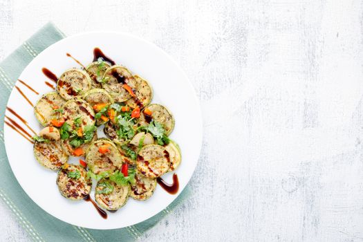 A dish of Fried zucchini on a white plate