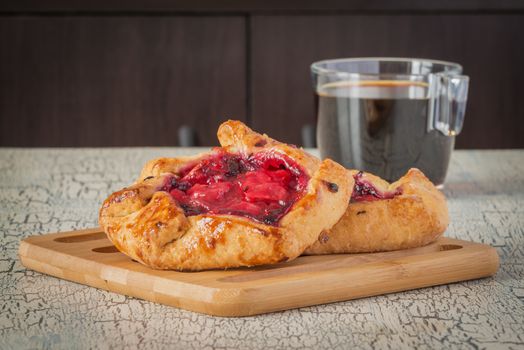 Homemade rustic fruit tarts served with fresh coffee.