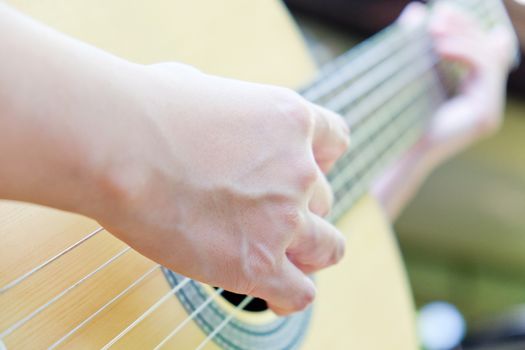close up of playing guitar background