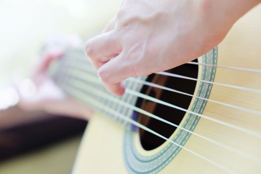 close up of playing guitar background