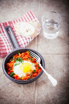 Traditional Middle Eastern dish of Shakshuka in a pan 