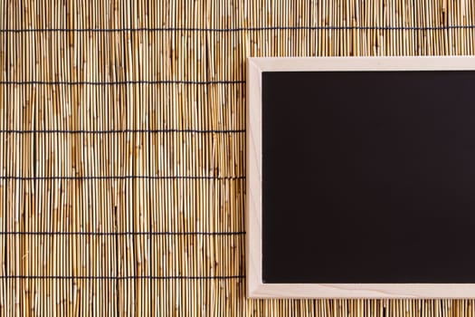 blackboard with bamboo blind background