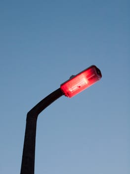 red street light outside turning on