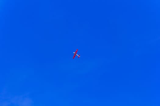 Photo of flying military airplane in blue sky