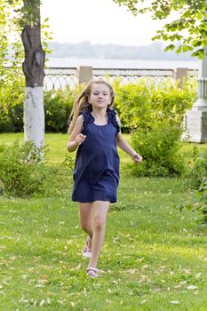 Cute running European girl with disheveled hair in summer