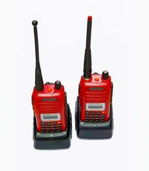 two red radio communication in chargers on white background