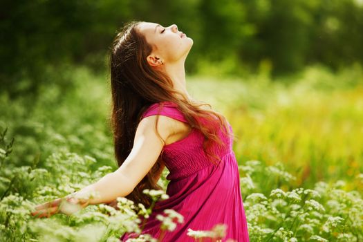 woman on green grass field feel freedom