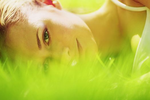 woman lay on grass close up