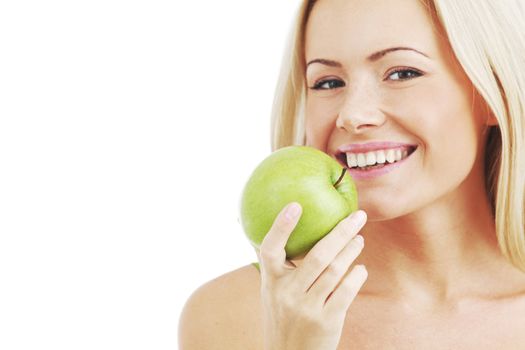 blond woman eat green apple on white