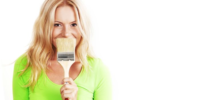 a woman with a brush against the wall