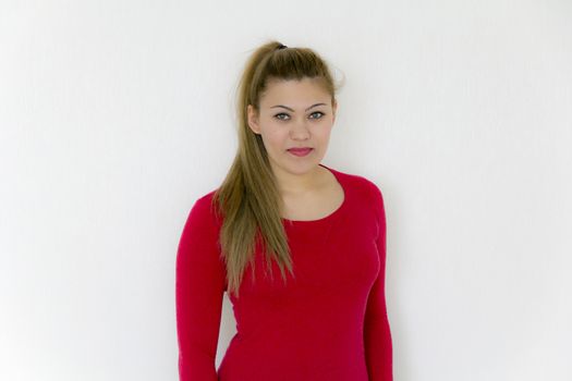 Attractive girl with long brown healthy straight hair in red