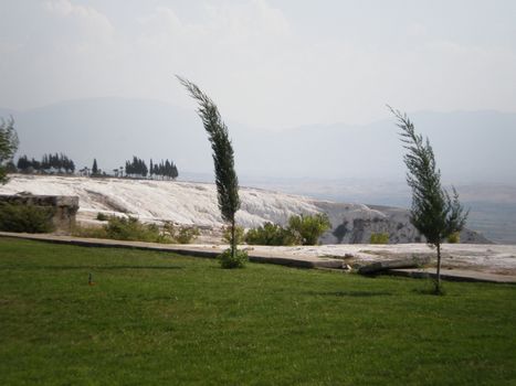 Pamukkale contains hot springs and terraces of carbonate minerals