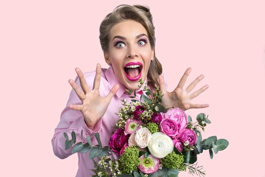 Woman surprised with bunch of flowers, funny emotional expression, shouting of happiness