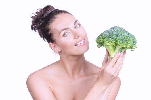 Portrait of a beautiful woman with perfect skin holding broccoli, isolated on white background