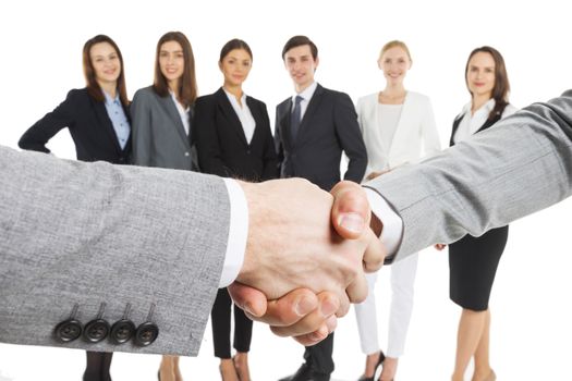 Business people handshake over team of people isolated on white background
