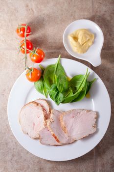 Slices of turkey breast fillet with green salad 