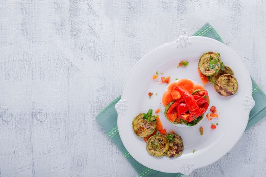 Rice timbale with fried zucchini, peppers, carrots