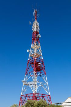 Communications tower with a beautiful blue sky on Puerto Real, Cadiz, Spain