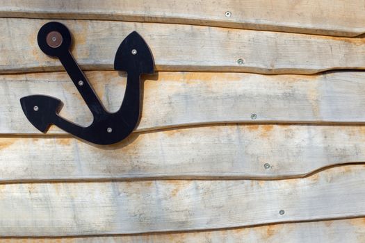 An anchor on wood, detail