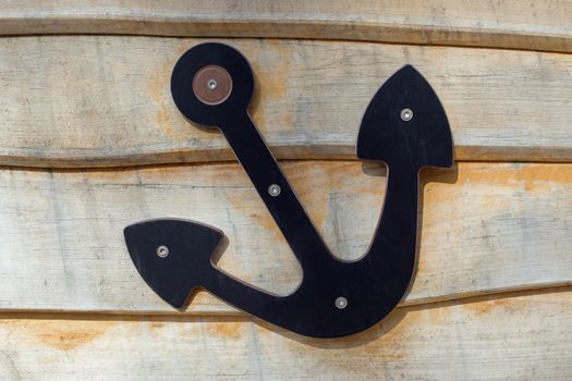 An anchor on wood, detail