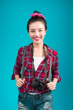 Woman travel. Young beautiful asian woman traveler on blue background