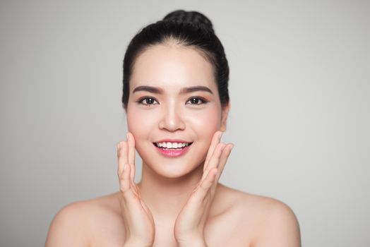 Beautiful Young Asian Woman with Clean Fresh Skin isolate on white background.