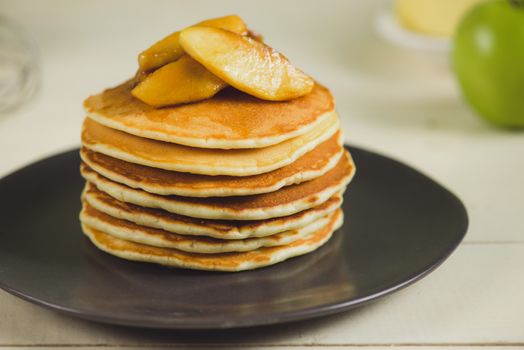 Pancakes with apple on table. Breakfast, snacks. Pancakes Day.