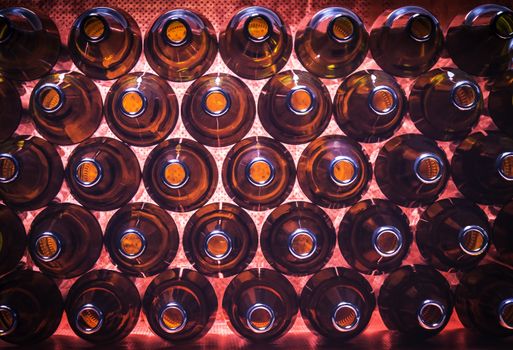 Closeup stack of brown color bottles background