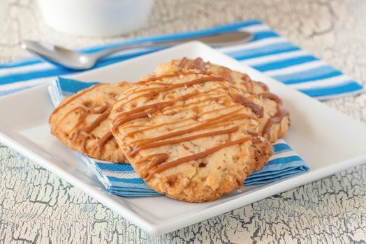 Plate of freshly baked salted caramel shortbread cookies.