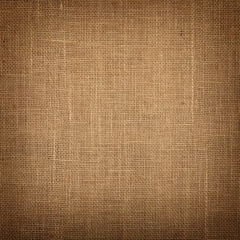 Square natural brown burlap jute sackcloth bagging canvas texture pattern background with dark shade border vignette