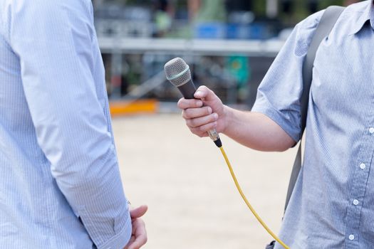 Microphone in focus. Press or media interview.