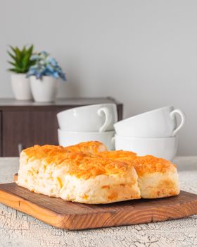 Fresh homemade cheddar cheese tea biscuits.  Ample toom for text.