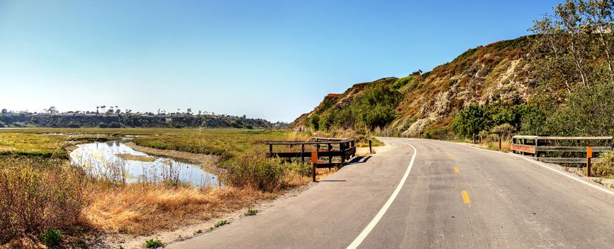 Newport Back Bay loop hiking trail winds along the marsh, where you will see wildlife in Newport Beach, California USA