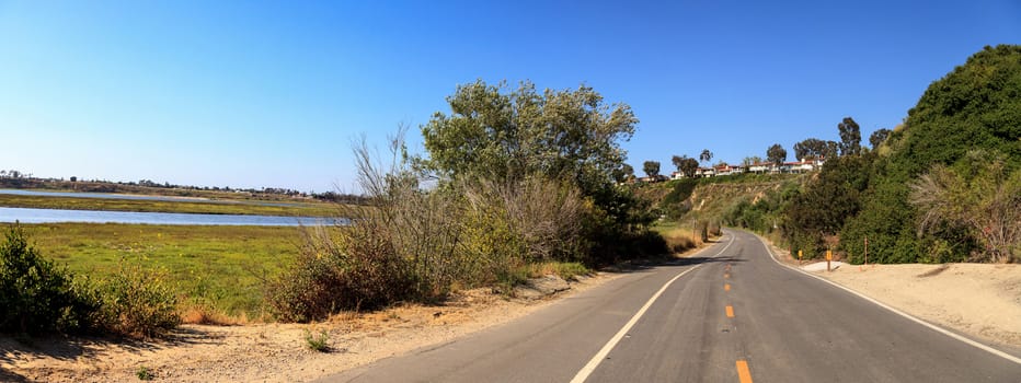 Newport Back Bay loop hiking trail winds along the marsh, where you will see wildlife in Newport Beach, California USA