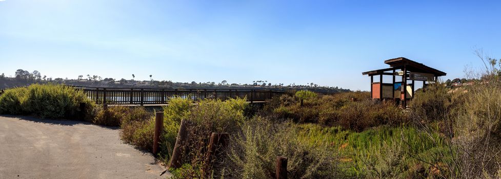 Newport Back Bay loop hiking trail winds along the marsh, where you will see wildlife in Newport Beach, California USA