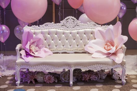 The luxurious room with pink and purple balloon for Background.Romantic chair.