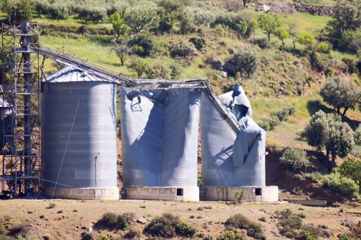 Grain silos blowing on a small hill in the center of Crete