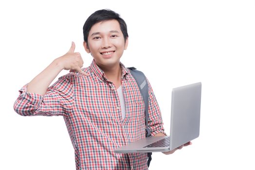 Portrait of young male asian student holding laptop