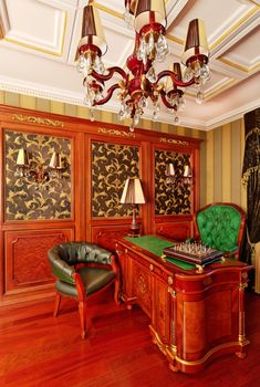 Classical interior ornate working space with chess