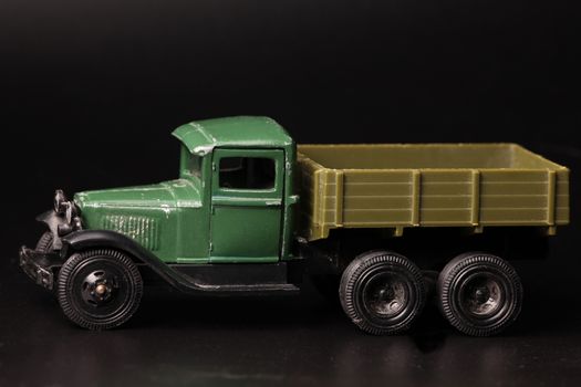 Truck vintage children's toy  black background macro shot