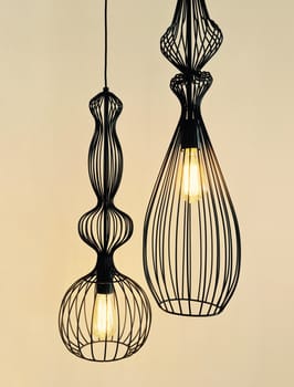 Pendant lamps made of black metal wire. Modern design.