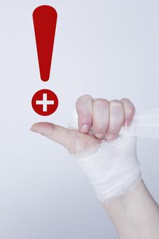 White medical dressing on a traumatized female hand