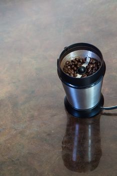 A coffee grinder with beans inside.
