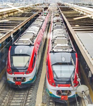 two modern trains at the station ready to move