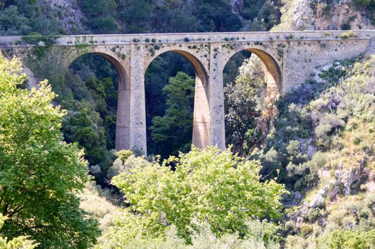 Ancient stone viaduct in the mountains of central Crete