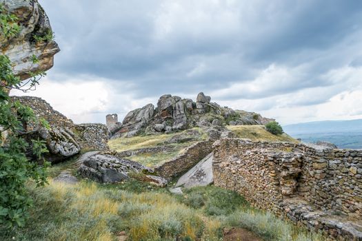 Ancient Hill Fortress with stone walls from their defence