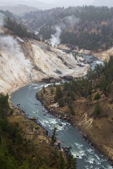 A portion of the Yellowstone River runs through a valley in Yellowstone National Park.