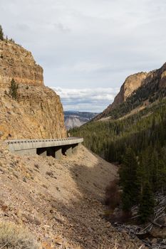 A road wraps around the mountainside in Yellowstone National Park.