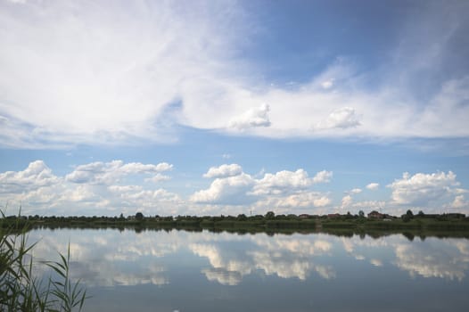 blue lake with cloudy sky, nature series